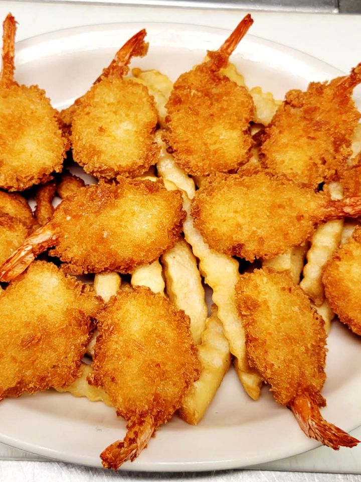 Fried fan tail shrimp with French fries